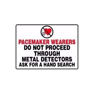 PACEMAKER WEARERS DO NOT PROCEED THROUGH METAL DETECTORS ASK FOR A 