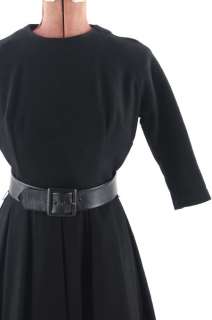 Beautiful late 1950s rich black wool dress. 100% wool, dress has 3/4 