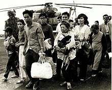 south vietnamese refugees arrive on a u s navy vessel during operation 