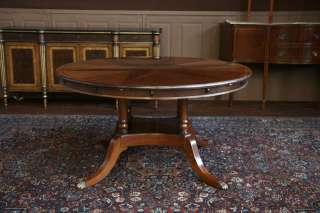 Round Mahogany Dining Table shown with no leaves in 60 position