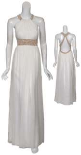 Angelic ivory silk evening gown. Beaded halter style neckline reveals 