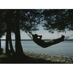  A Person Relaxes in a Hammock That Overlooks Lake Michigan 