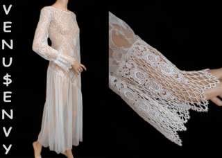 This 80s white sheer lace dress is in the Victorian style. It has 