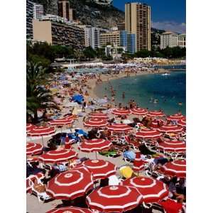  Overhead of Red Sun Umbrellas at Larvotto Beach on Busy 