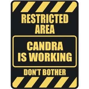   RESTRICTED AREA CANDRA IS WORKING  PARKING SIGN