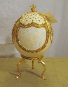 This is a beautiful, decorative and authentic Ostrich Egg music box 