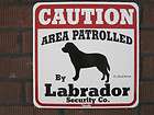 Sign CAUTION AREA PATROLLED by Labrador Security Co.