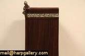 An armoire, bar cabinet or chifferobe is mahogany, with marquetry 