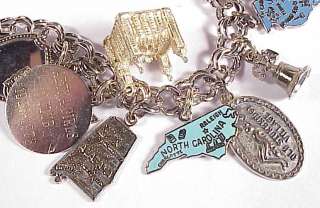 Measures about 7 1/8 long Marked Sterling 19 charms of places 