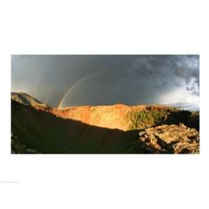 Crater of an extinct volcano with a rainbow in the sky Poster (24.00 x 