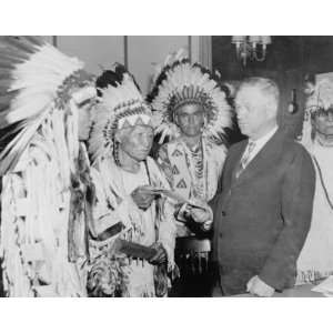  1935 photo Secretary of Interior Harold Ickes handing 