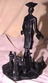 this cast iron figurine was made in russia by artist