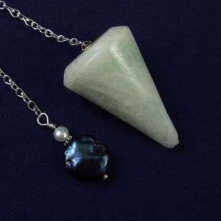 You are considering a beautiful crystal pendulum with an organza 