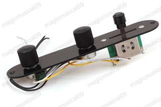 This is a wired black plate control plate with knobs and switch for 