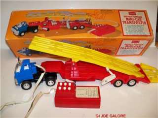 (BATTERY OPERATED MINI CAR TRANSPORTER)REDLINES)EARLY 70s)MIB 