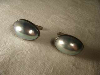  at a pair of sterling silver mabe pearl cufflinks. Each cufflink 