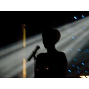  Female Singer and Microphone Silhouetted with Stage Lights 